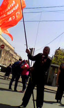 John Robles holding Communist flag during Victory Day 2015 in Moscow